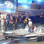 Chris Lane waving while being trailered in during Bassmaster Classic 2016 Day 2 weigh-in