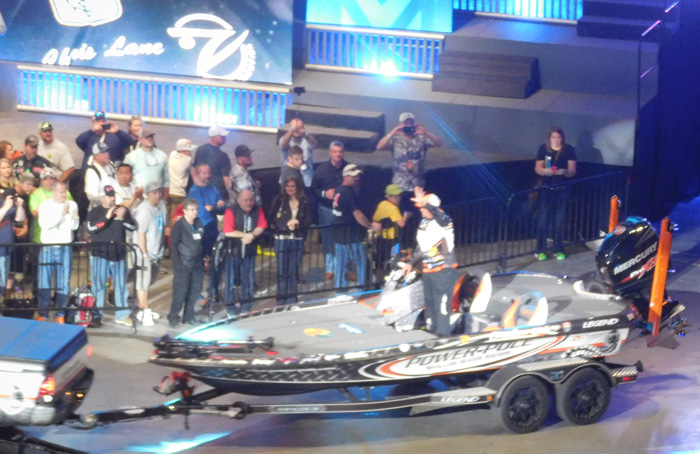 Chris Lane waving while being trailered in during Bassmaster Classic 2016 Day 2 weigh-in