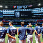Julie Budzinski moment of silence at baseball game. Boston Herald photo.