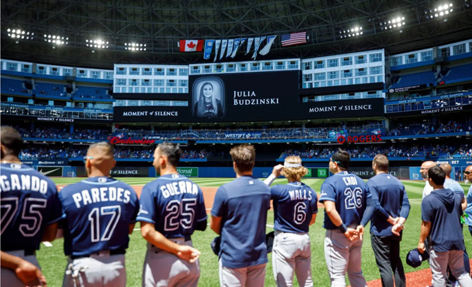 Julie Budzinski moment of silence at baseball game. Boston Herald photo.