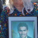 Marion Irving de Cruz with photo of he son Emilio