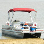 Pontoon Boat anchor on shore