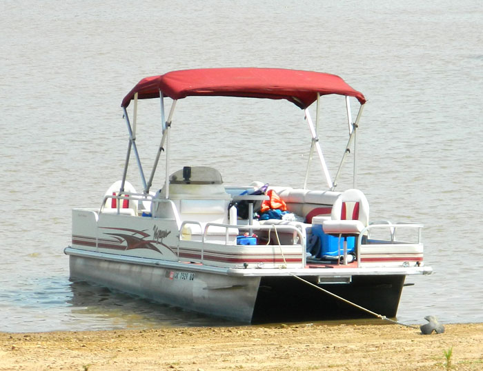 Pontoon Boat anchor on shore