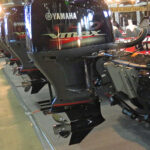 Large outboard motors lined up at 2014 Tulsa Boat Show.