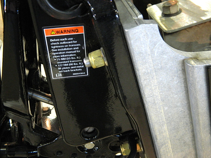 Warning outboard bolts, 2014 Tulsa Boat Show. Mercury Marine outboard on jack plate.